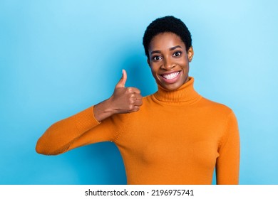 Photo Of Unisex Person Raise Thumb Up Approve Choice Wear Yellow Turtleneck Isolated Blue Color Background