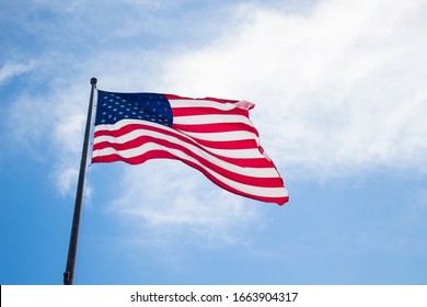 photo to the united state flag moving with the wind