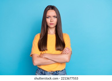 Photo of unsatisfied lady orange outfit bad mood negative reaction stand empty space clothes isolated on blue color background