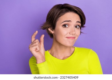 Photo of unsatisfied young person arm fingers demonstrate tiny small size gesture isolated on violet color background - Shutterstock ID 2327405409