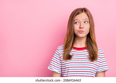 Photo Of Unsure Teen Girl Look Promo Wear Red T-shirt Isolated On Pink Color Background