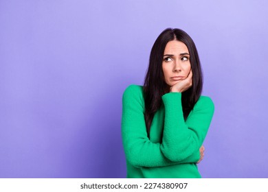 Photo of upset bored woman wear green pullover arm chin looking emtpy space isolated purple color background