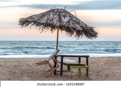 Photo of vacant beach shack made up of dried coconut leaves on a deserted beach of tropical island during sunset amidst the complete lockdown in the wake of COVID-19 virus causing pandemic. - Image.