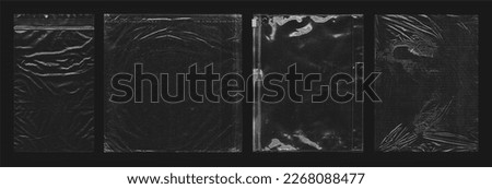 Photo of various polyethylene packages on a black background. Polythene wraps for an overlay effect. This is a photograph of rumpled packages of various shapes and sizes.