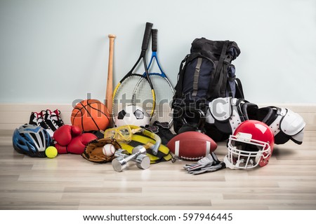 Photo Of Various Sport Equipments On Hardwood Floor