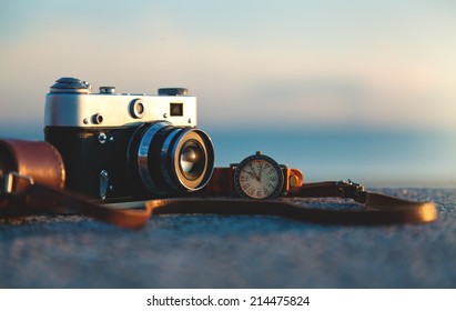 Photo of vintage camera at sunset in park - Powered by Shutterstock