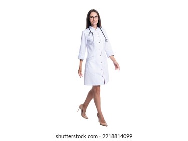 Photo Of Walking Cardiologist Woman Wear White Coat. Cardiologist Woman Doctor With Stethoscope.