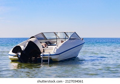 Photo Of White Colored Motor Boat Drifting In Mid Day Open Sea.