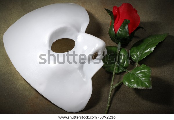 Photo of White Mask and a Fabric Rose - Opera Concept