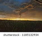 Photo of a windmill underneath a severe thunderstorm in Northeastern Colorado at sunset on May 17, 2018.