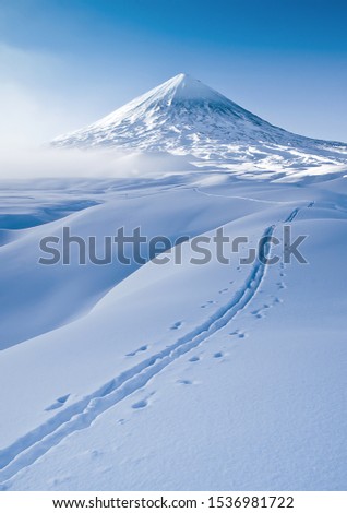 Photo of a winter trip to Klyuchevskaya Sopka. Klyuchevskaya Sopka is an active volcano of the Kamchatka Peninsula, the highest point in Eurasia.