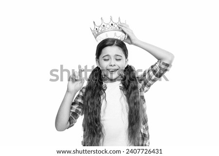 photo of wishing teen girl in princess crown. teen girl in crown isolated on white. teen girl