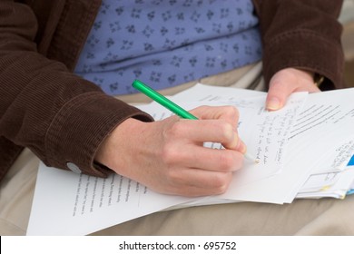 Photo Of A Woman Grading Papers