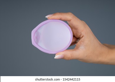 Photo Of Woman Holding Diaphragm For Contraceptive Use