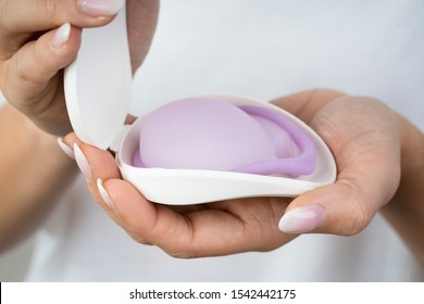 Photo Of Woman Holding Diaphragm For Contraceptive Use