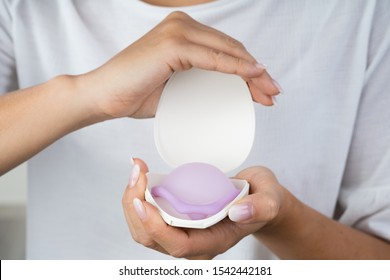 Photo Of Woman Holding Diaphragm For Contraceptive Use