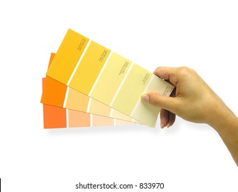 A Photo Of A Woman Holding Paint Swatches To A Wall