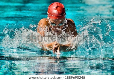 Photo of Woman Swimming in a swimming pool