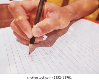 Photo of a woman's hand writing the word "good" on a piece of paper - Powered by Shutterstock