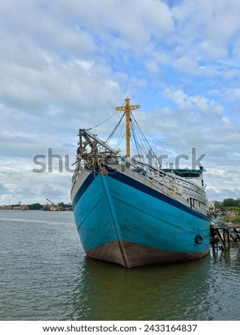 Photo of a wooden boat or KLM being docked at the port of Bangka belitung