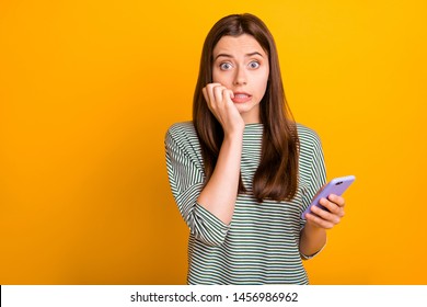 Photo Of Worried Concerned Girlfriend Seeing Her Phone Screen Cracked And Shattered To Pieces While Isolated With Yellow Background