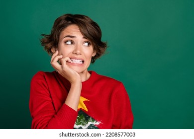 Photo Of Worried Unsatisfied Lady Biting Finger Nails Look Empty Space Horrified Isolated On Green Color Background