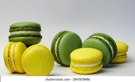 Photo Of Yellow And Green Macarons On A Gray Background Close-up