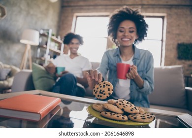 Photo of young african couple happy positive smile eat cookies dessert yummy sweet calories drink coffee tea indoors - Powered by Shutterstock