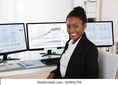 Photo Of Young African Stock Broker In Office