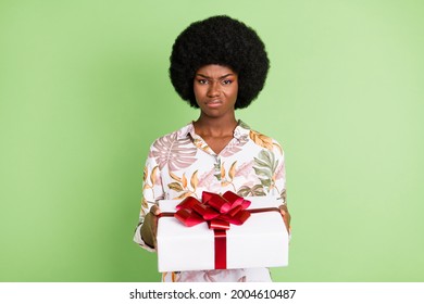 Photo Of Young Afro Girl Unhappy Sad Upset Dislike Present Gift Box Isolated Over Green Color Background