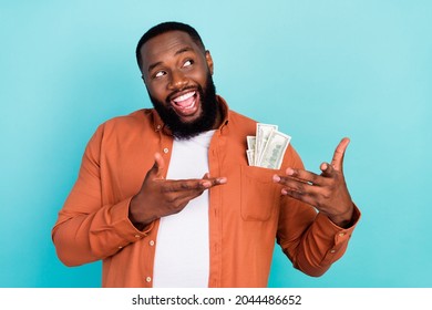 Photo Of Young Afro Man Happy Positive Smile Rich Businessman Cash Money Dollars Look Empty Space Isolated Over Teal Color Background