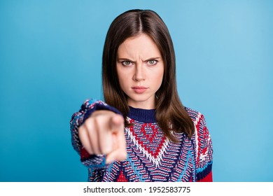 Photo of young angry girl indicate finger you accuse blame trouble isolated over blue color background