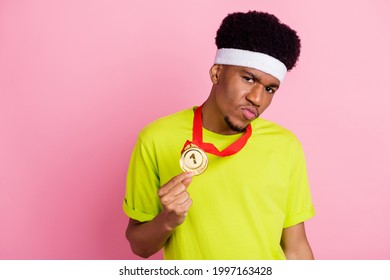 Photo of young arrogant afro guy sportsman show gold medal victory isolated over pink color background - Powered by Shutterstock