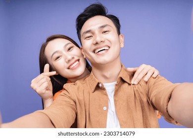 Photo of young Asian couple on background - Powered by Shutterstock