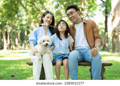 Photo of young Asian family at park - Powered by Shutterstock