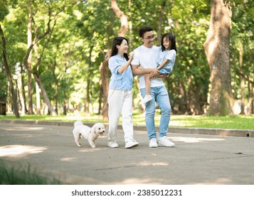 Photo of young Asian family at park - Powered by Shutterstock