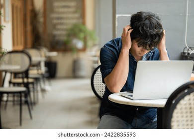 Photo of young Asian man at coffee shop - Powered by Shutterstock