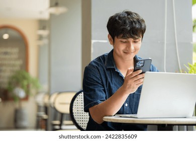 Photo of young Asian man at coffee shop - Powered by Shutterstock