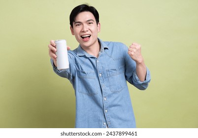 Photo of young Asian man on background - Powered by Shutterstock