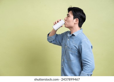 Photo of young Asian man on background - Powered by Shutterstock