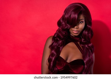 Photo of young attractive african woman attractive charming fancy isolated over red color background