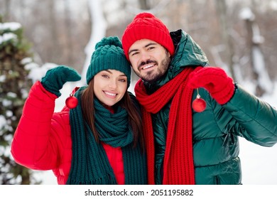 Photo of young attractive couple happy positive smile hug hold new year balls toys decoration winter snow