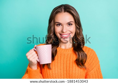 Photo of young attractive girl happy positive smile enjoy morning cup of coffee isolated over turquoise color background