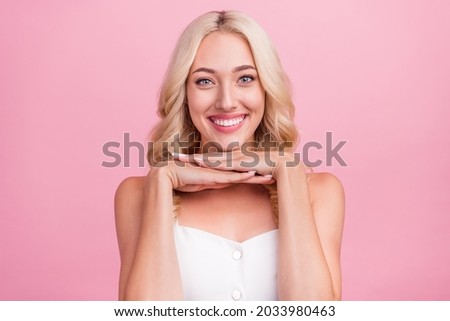 Photo of young attractive girl happy positive smile hands touch chin perfect pure skin isolated over pink color background