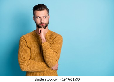 Photo of young attractive handsome thoughtful man thinking look copyspace hold hand chin isolated on blue color background