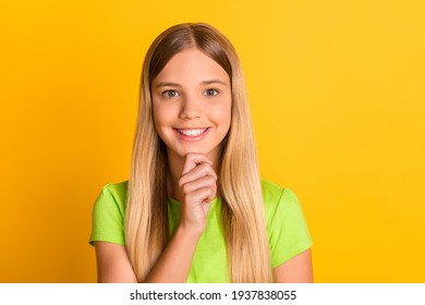 Photo Of Young Attractive School Girl Happy Positive Smile Think Hand Touch Chin Isolated Over Yellow Color Background