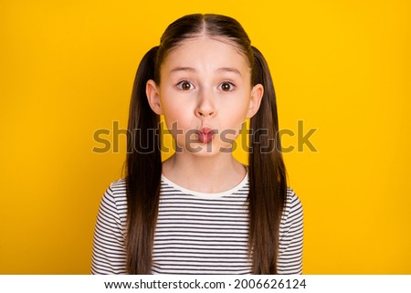 Photo of young attractive school girl pouted lips send air kiss isolated over yellow color background