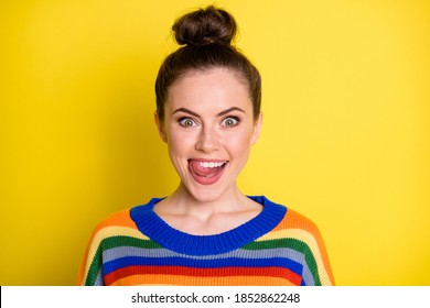 Photo of young attractive woman happy positive smile excited amazed tongue-out tasty lick teeth isolated over yellow color background