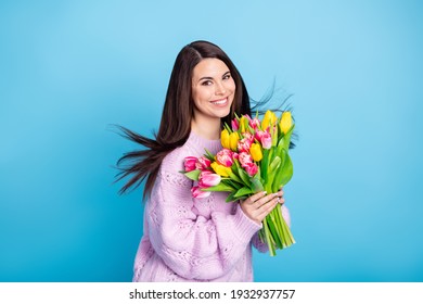 Photo Of Young Attractive Woman Happy Positive Smile Hold Flower Bouquet Spring Holiday Isolated Over Blue Color Background