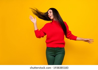 Photo of young beautiful charming lovely dreamy woman dancing with flying hair isolated on yellow color background